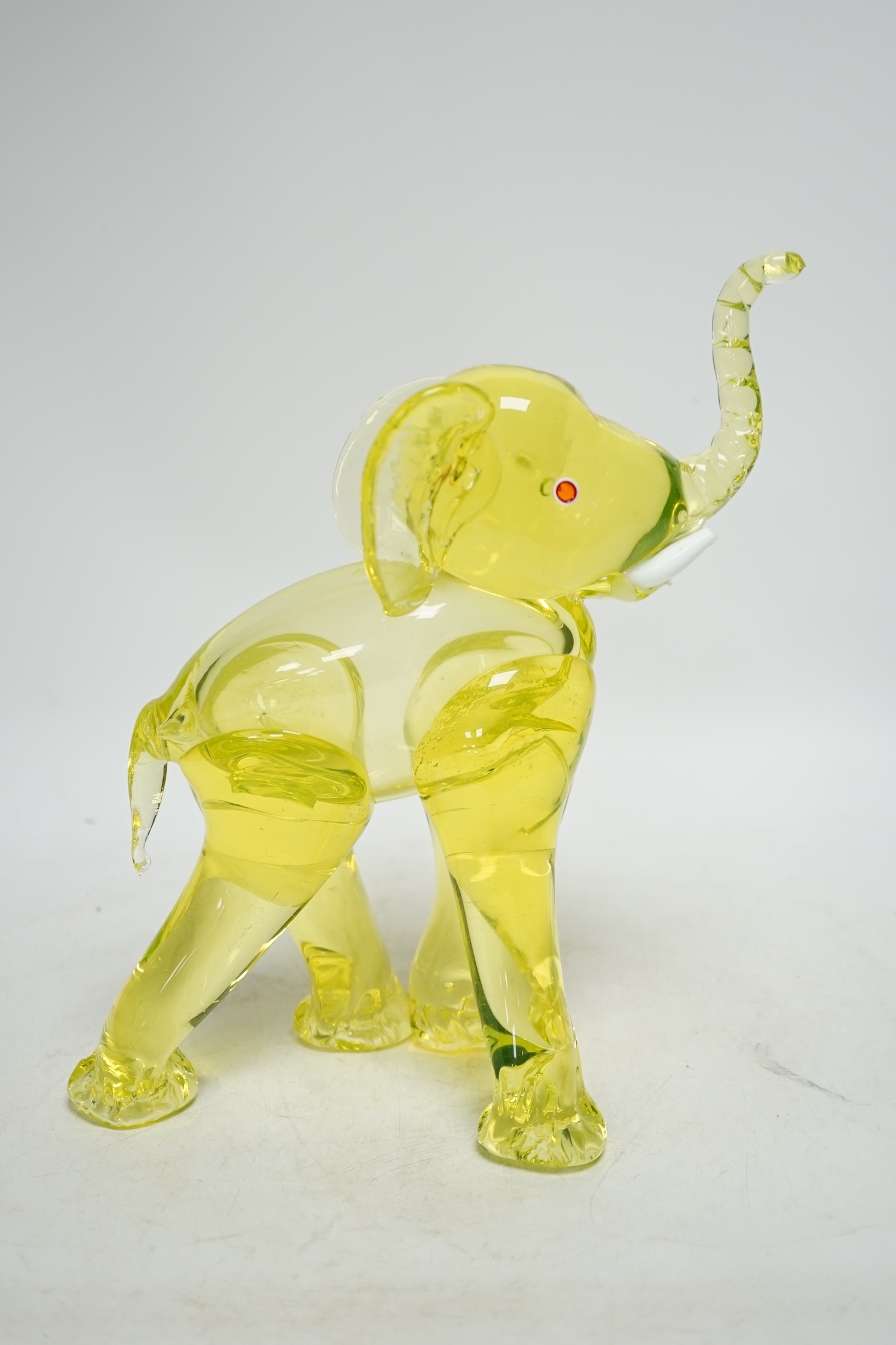 A Murano uranium glass model of an elephant, 26cm. Condition - good.